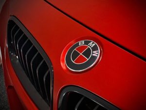 3 Series Satin Red - close-up of BMW badge