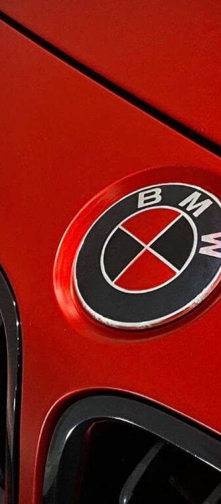 3 Series Satin Red - close-up of BMW badge
