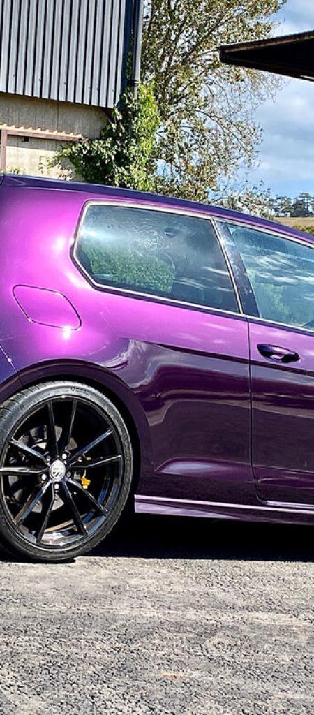 Side view of a purple Golf R